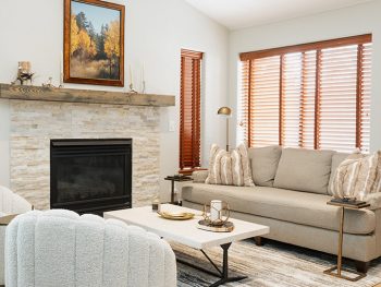 Living room with fireplace, sofa, sofa table, chairs, interior design services example